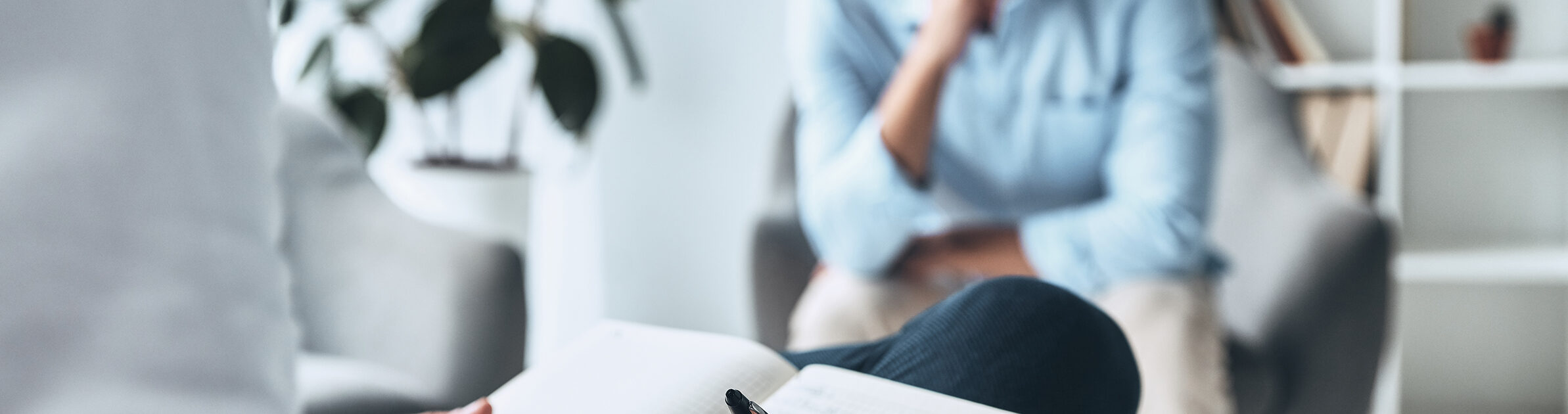 Young frustrated man solving his mental problems while having therapy session with psychologist